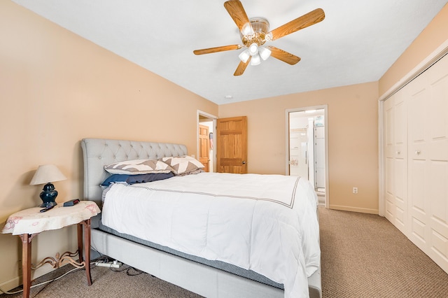 bedroom featuring ceiling fan, a closet, and light colored carpet