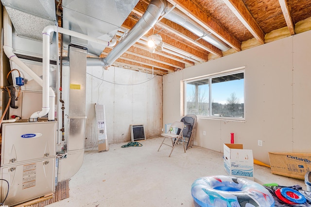 basement featuring heating unit