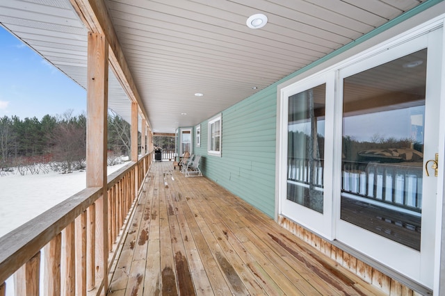 view of snow covered deck