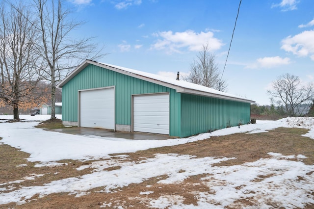 view of snow covered garage