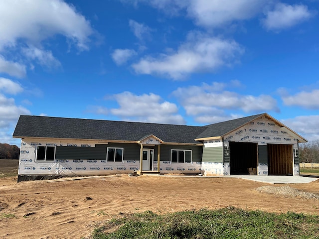 property in mid-construction featuring an outdoor structure and a garage