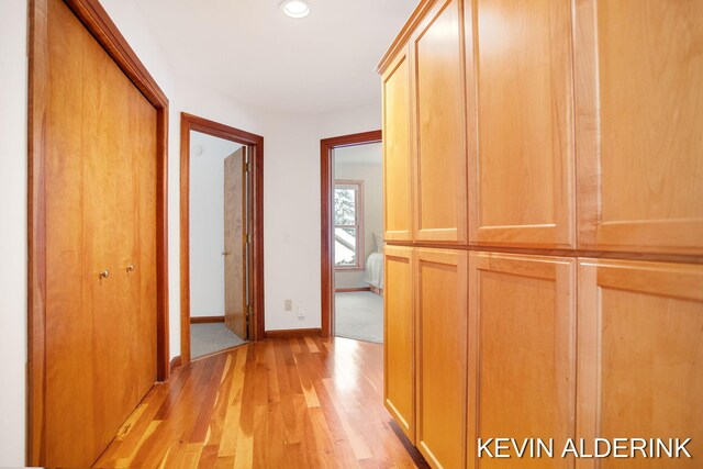 corridor featuring light hardwood / wood-style floors