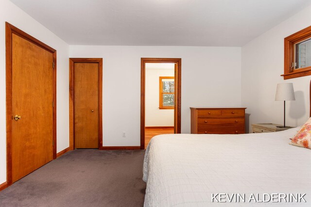 bedroom featuring light carpet