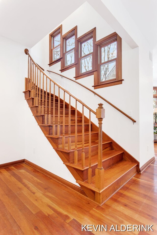 staircase featuring hardwood / wood-style flooring