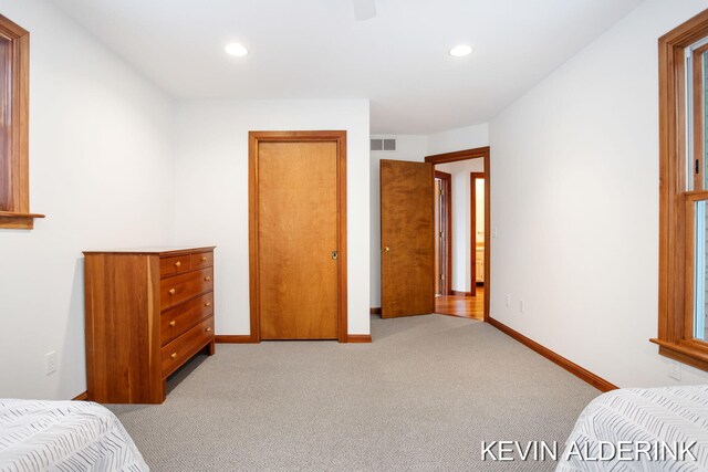 carpeted bedroom with ceiling fan