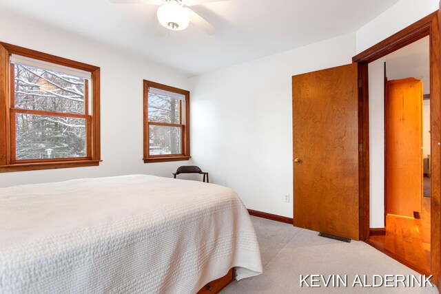 carpeted bedroom with ceiling fan