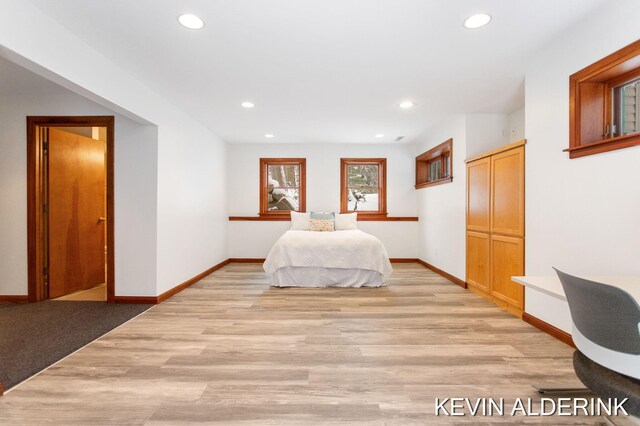 bedroom featuring a closet and light hardwood / wood-style floors