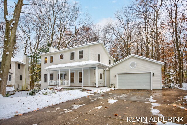 view of front of house featuring a garage and covered porch