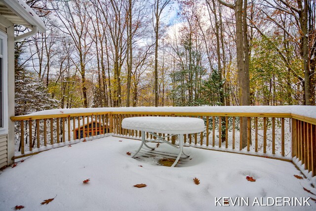 view of snow covered deck