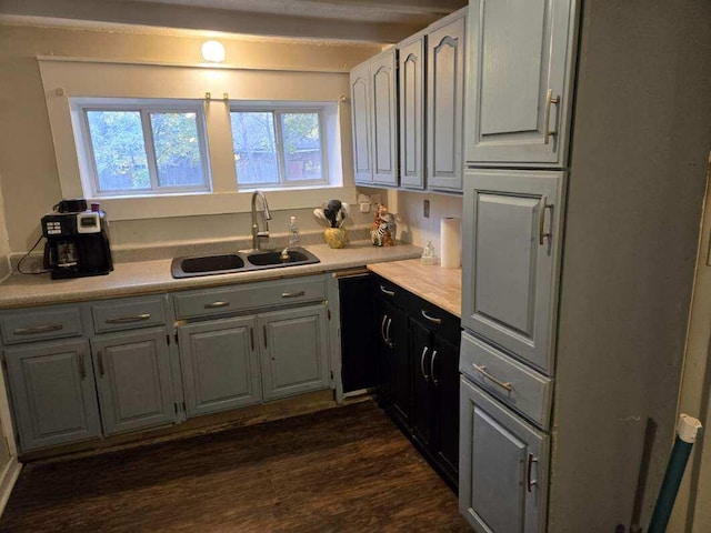 kitchen with gray cabinets, sink, and dark hardwood / wood-style floors