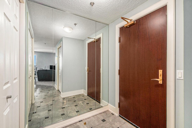 interior space featuring a textured ceiling