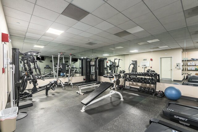 workout area featuring a drop ceiling