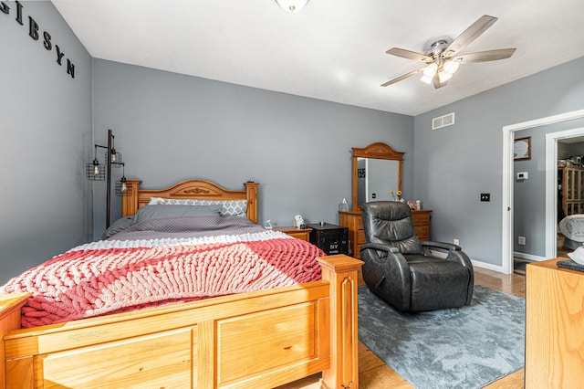 bedroom featuring hardwood / wood-style flooring and ceiling fan