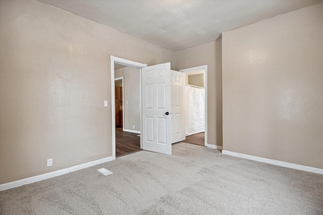 unfurnished bedroom with carpet floors