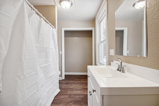 bathroom with wood-type flooring and vanity