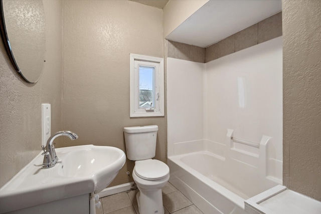 full bathroom with tile patterned flooring, vanity, tub / shower combination, and toilet