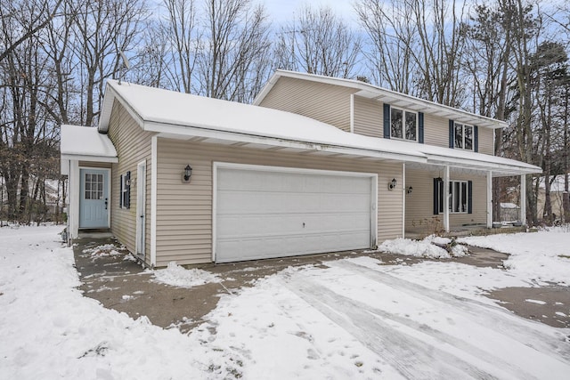 view of front of home featuring covered porch and a garage