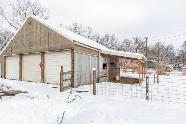 view of snow covered garage