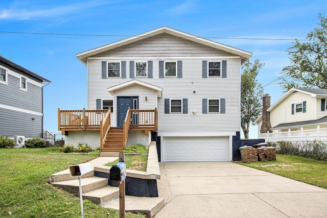 view of property with a garage, a wooden deck, and a front lawn