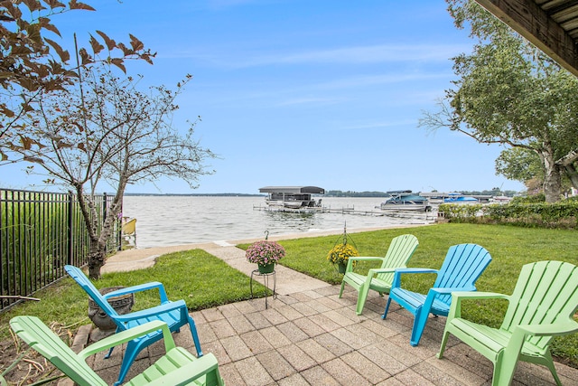 view of patio featuring a boat dock and a water view