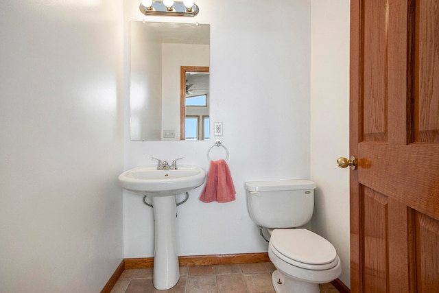 bathroom featuring tile patterned flooring and toilet