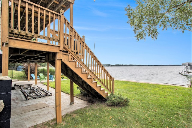 exterior space with a patio and a water view