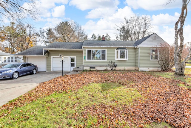 ranch-style house featuring a garage