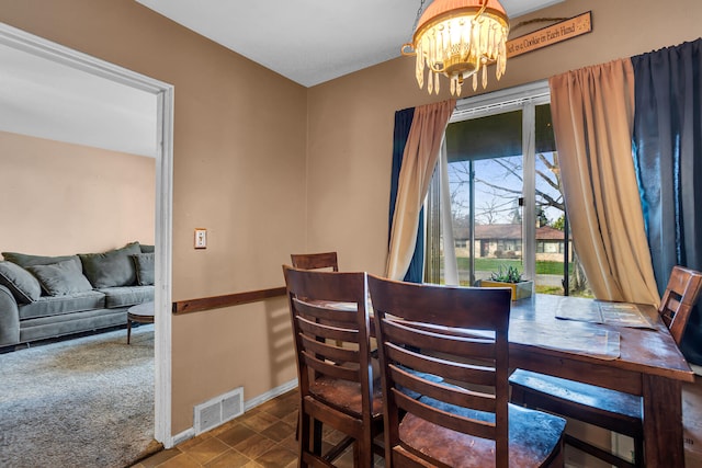 dining room featuring a chandelier