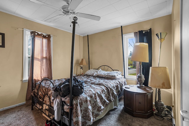 bedroom with dark carpet and ceiling fan