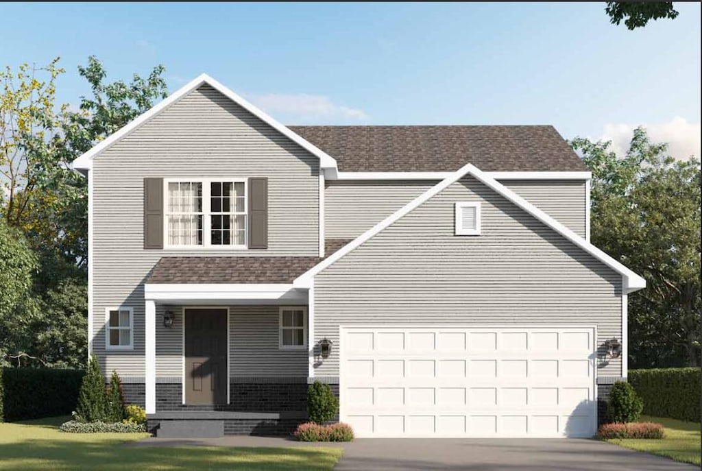 view of front property featuring a garage and a front lawn