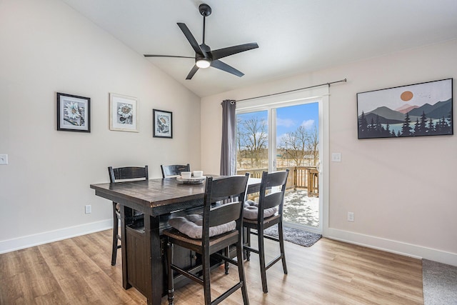 dining area featuring lofted ceiling, ceiling fan, and light hardwood / wood-style flooring