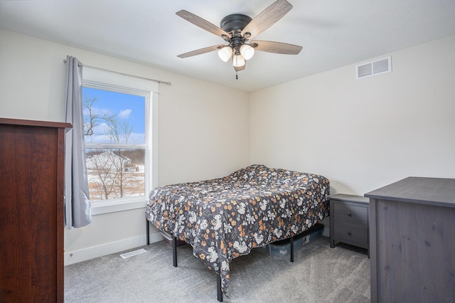 bedroom with light colored carpet and ceiling fan