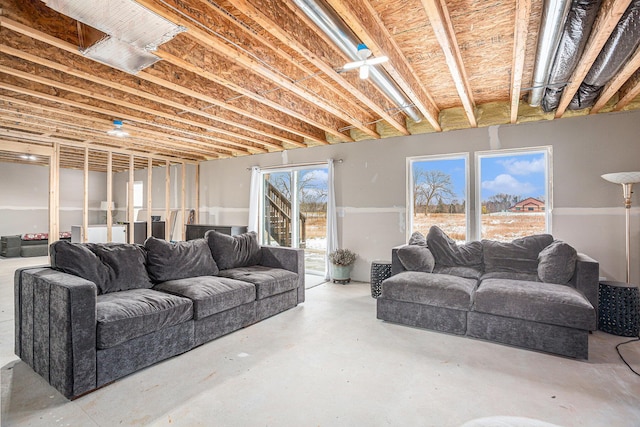 living room featuring concrete flooring