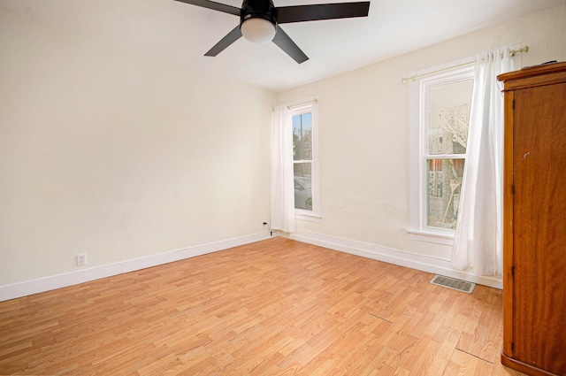 unfurnished room featuring light hardwood / wood-style flooring and ceiling fan