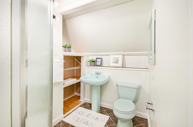 bathroom with tile patterned flooring, toilet, and sink