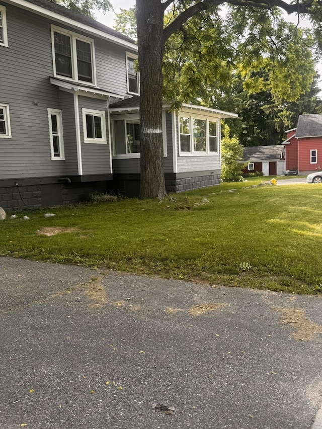 exterior space with a front lawn