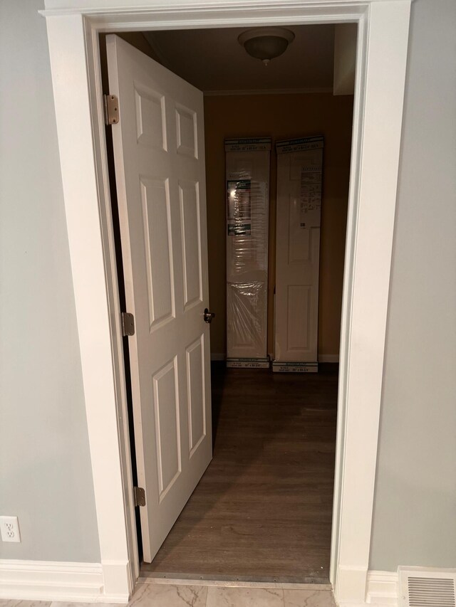 hallway featuring hardwood / wood-style flooring