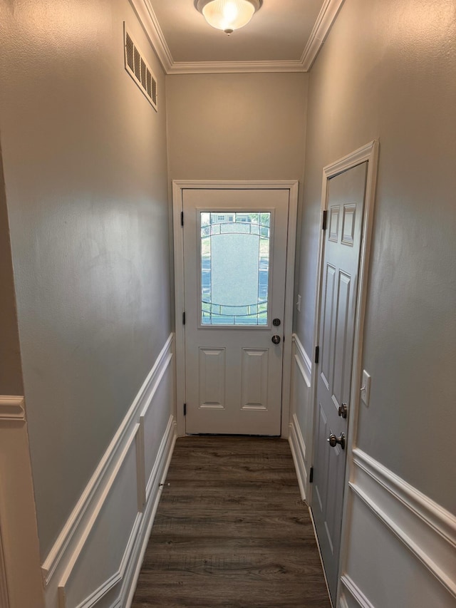 doorway with dark hardwood / wood-style floors and crown molding