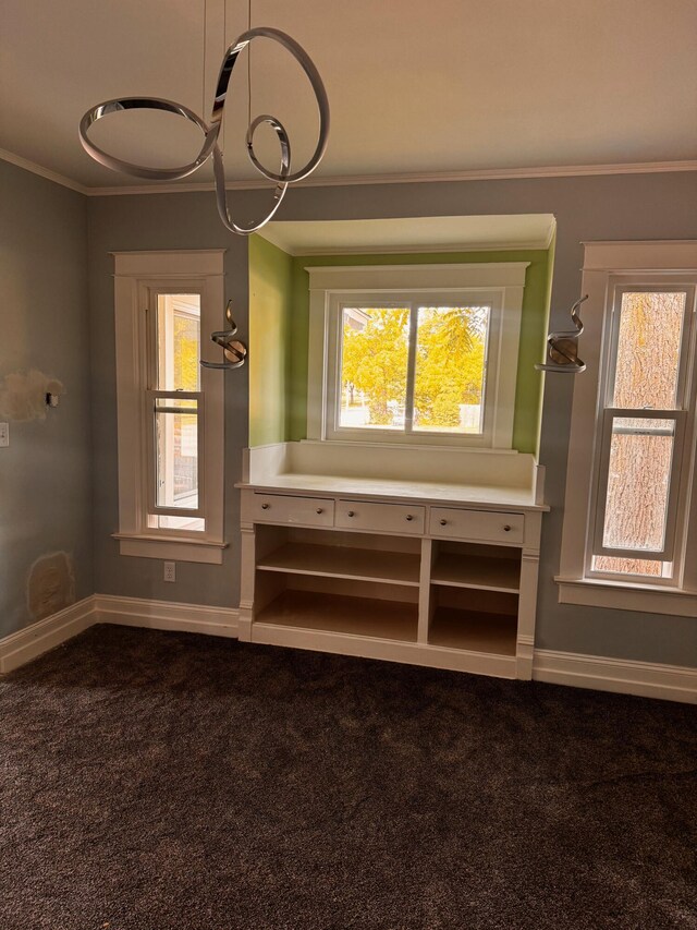 unfurnished living room with carpet flooring and ornamental molding