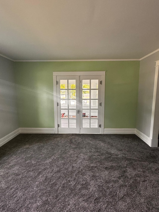 carpeted spare room featuring crown molding