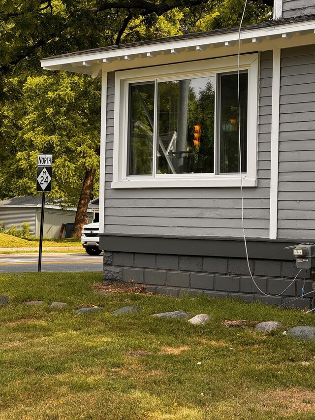 view of home's exterior featuring a yard