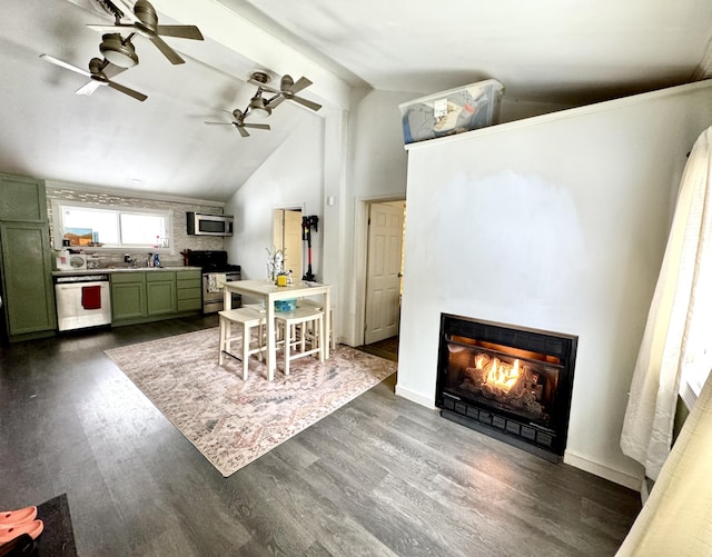 dining space with dark hardwood / wood-style flooring and lofted ceiling