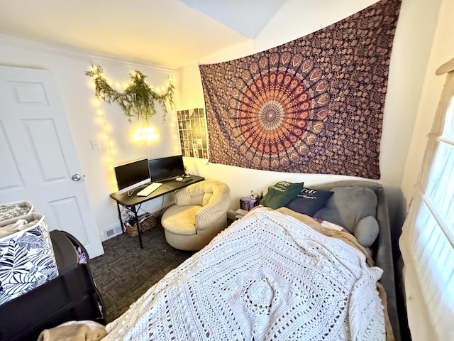 bedroom with crown molding