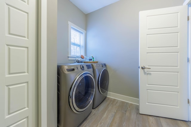 washroom featuring light hardwood / wood-style floors and independent washer and dryer