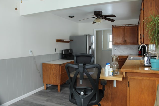 office space with sink, ceiling fan, and hardwood / wood-style floors