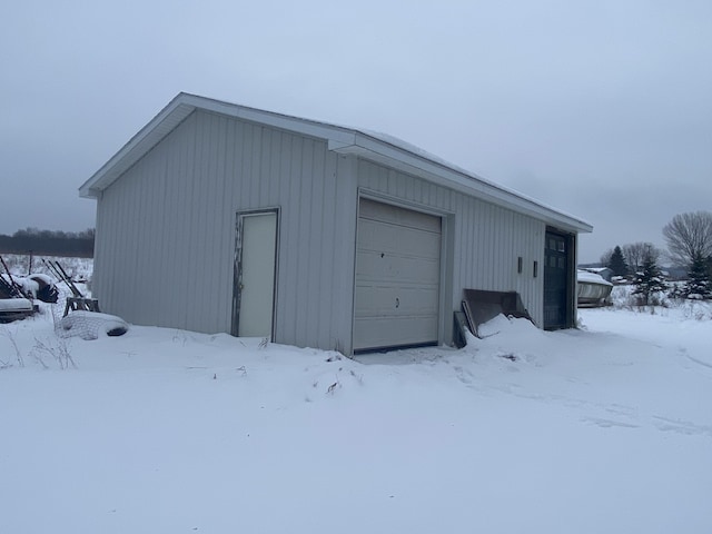 view of snow covered garage