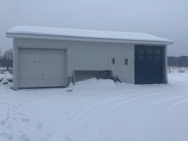 view of snow covered garage