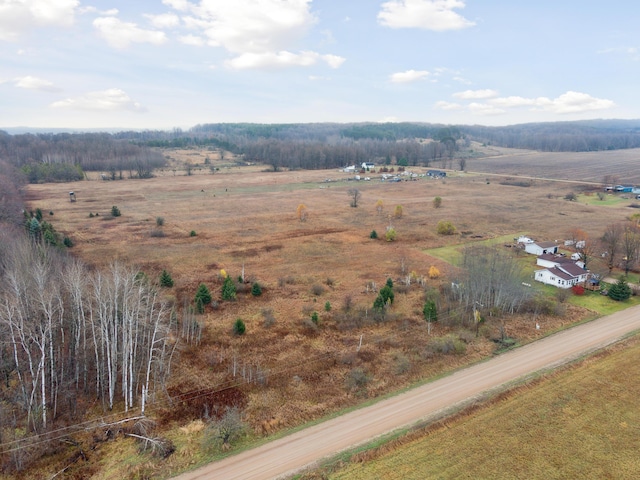 birds eye view of property featuring a rural view