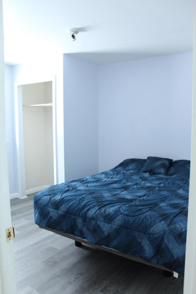 bedroom featuring hardwood / wood-style floors