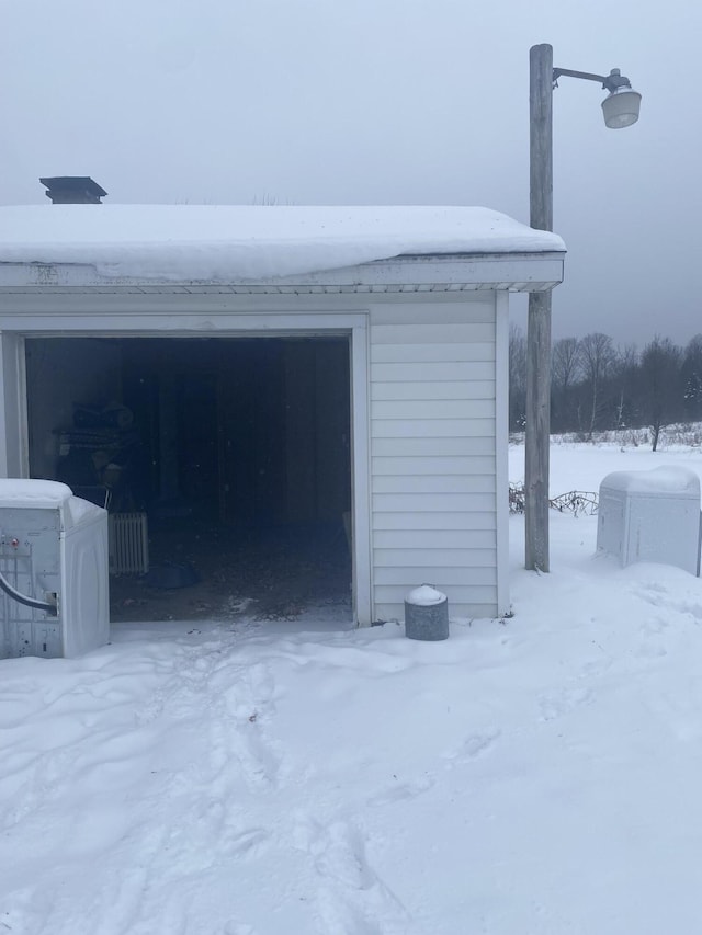 view of snow covered garage